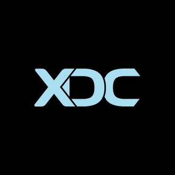 The XDC Network logo, featuring stylized "XDC" lettering in light blue against a black background, is displayed to represent the blockchain network mentioned in the announcement about Clear Street joining as a Masternode Validator.