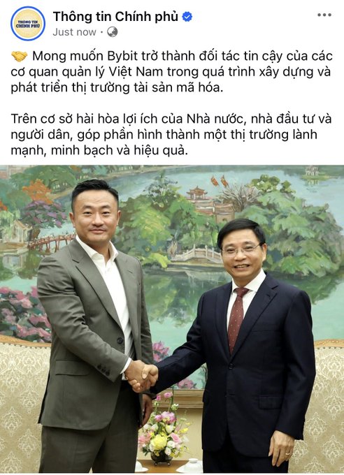 The image features two men dressed in suits shaking hands over a vase filled with flowers. The background of the photo shows a painting depicting a river surrounded by trees. The caption of the image reads "Bybit Meets with Government Officials On the morning of June 4, at the Government headquarters, Deputy Prime Minister Nguyễn Văn Thắng met with Mr. Ben Zhou, co-founder and CEO of Bybit."