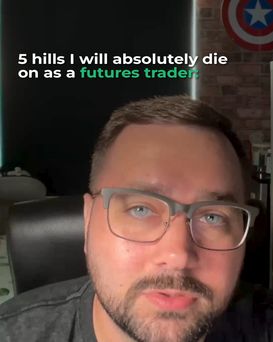 A man with glasses speaks to the camera with the caption "5 hills I will absolutely die on as a futures trader" overlaid in white and green text, with a Captain America shield on the brick wall behind him.