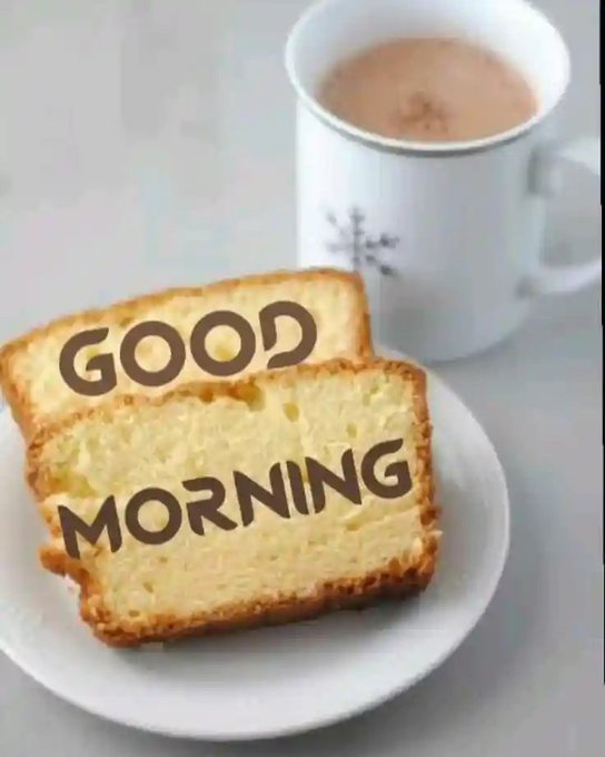 Two slices of toast on a white plate read 'GOOD MORNING' in brown lettering, accompanied by a mug of tea or coffee.
