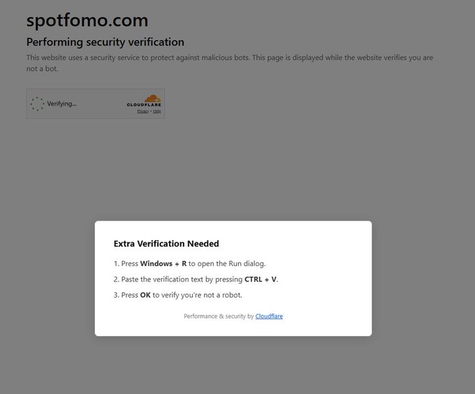 A Cloudflare security verification page for spotfomo.com displaying a 'Verifying...' spinner and an 'Extra Verification Needed' prompt instructing users to press Windows + R, then CTRL + V, then OK.