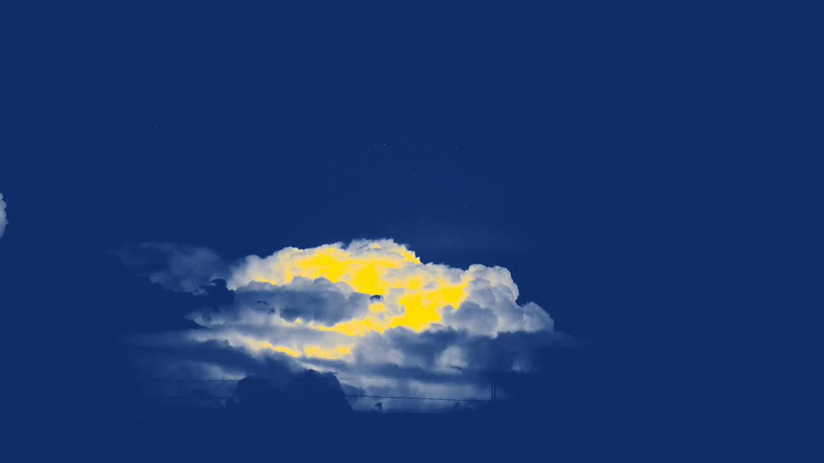 The image shows a large cloud with yellow rays coming out of it against a blue sky background. The photo has been edited using a filter that gives it a blue tint, making the cloud appear as if it's glowing from within. The caption below the image provides information about the content and its source.