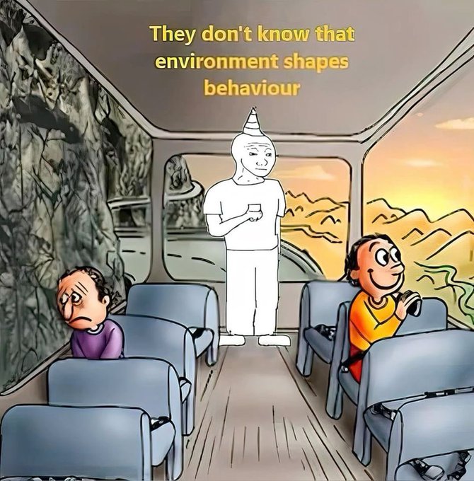 A meme illustration showing two passengers on a bus viewing different scenery—a rocky cliff and a sunset landscape—with a caption reading 'They don't know that environment shapes behaviour'.