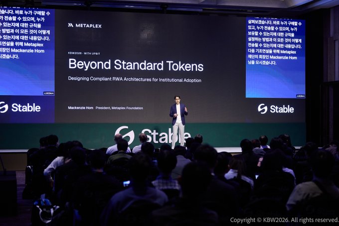 A conference presentation titled 'Beyond Standard Tokens: Designing Compliant RWA Architectures for Institutional Adoption,' delivered by Mackenzie Horn, President of the Metaplex Foundation, at a KBW2026 event sponsored by Stable.