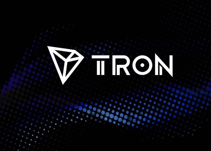 The Tron cryptocurrency logo displayed in white against a dark background with a blue dotted wave pattern.