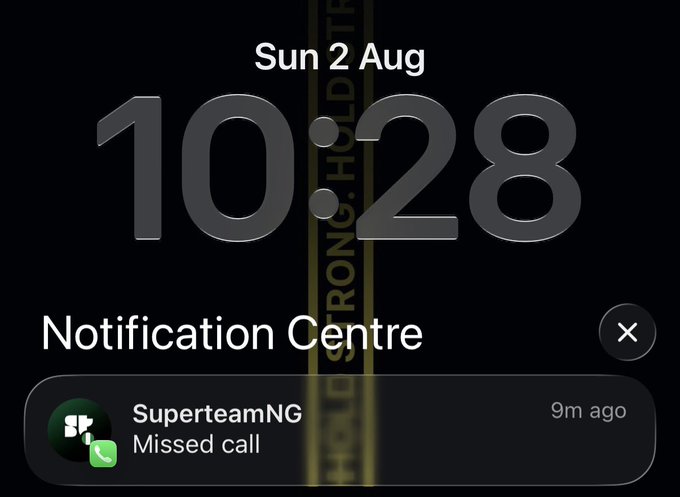 A smartphone lock screen showing the time 10:28 on Sunday, 2 August, with a notification from SuperteamNG indicating a missed call from 9 minutes ago.