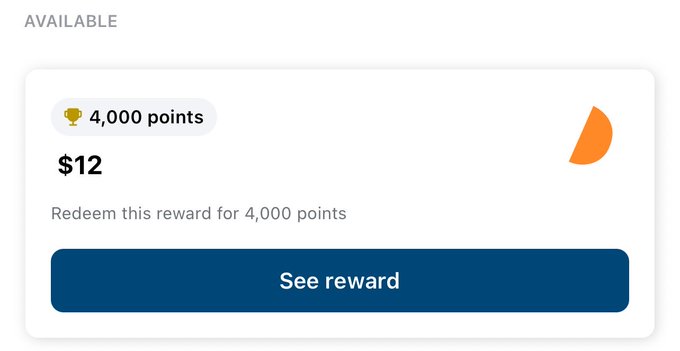 The image shows an app screen displaying a rewards system for users who participate in certain activities, such as trading cryptocurrency or using a specific service. The screen features a blue rectangle with white text that reads "Available" and "4,000 points". Below this, there is a small orange circle containing the text "See reward". In addition to these elements, there are two other smaller circles on the right side of the image.
