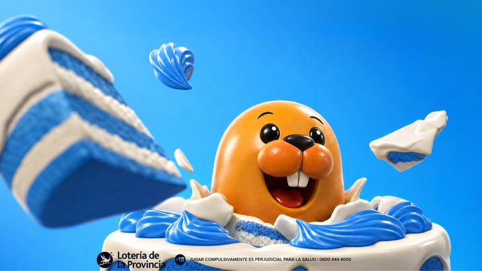 A cheerful, orange mole mascot bursts out of a blue-and-white frosted cake with floating candy pieces against a bright blue background, with the "Lotería de la Provincia" logo and a responsible gambling notice ("JUGAR COMPULSIVAMENTE ES PERJUICIAL PARA LA SALUD | 0800 444 4000") displayed at the bottom. The image ties into the post's birthday celebration for Stake, visually presenting the festive, gift-giving theme of the promotion offering $100,000 ARS prizes.