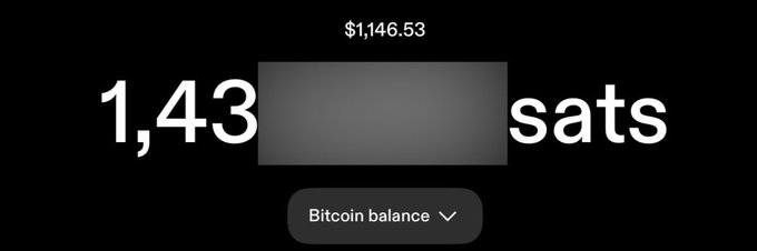 A screenshot showing a Bitcoin balance displayed in sats with the value partially obscured, showing $1,146.53 above and a 'Bitcoin balance' dropdown menu below.