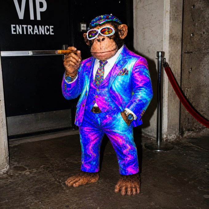 A figure in a psychedelic blue and purple three-piece suit and matching cap, styled as a Bored Ape NFT, smokes a cigar by a "VIP ENTRANCE" sign, mirroring the caption's playful self-reference to a crypto token launch—evoking the meme of a degenerate NFT ape waiting for airdrop fees to roll in.