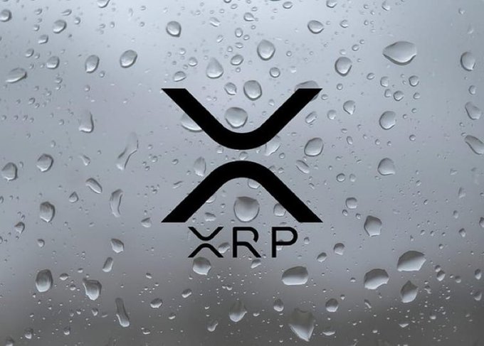 The XRP cryptocurrency logo displayed in black against a background of water droplets on glass.