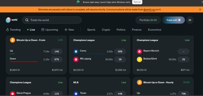 A screenshot of the World trading app interface on X, showing trending prediction markets including "Bitcoin Up or Down - 5 min," Champions League matches (Como vs RB Leipzig, Bayern Munich vs Bodoe/Glimt, Slavia Prague vs Texas), and MLB, with a notice that stymmies are paused until rollout is complete.