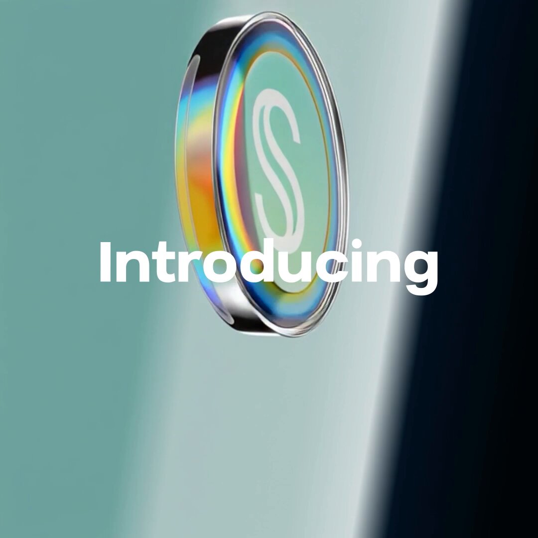 The image features a coin with the word "Introducing" written above it, which appears to be a new type of cryptocurrency or digital token. The coin has a unique design that includes a green circle with a white letter "S" on it. The background is a light blue color, and there are two lines in the image: one at the top left corner and another at the bottom right corner.