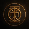 A golden glowing circular emblem featuring stylized letters, possibly 'CZ' or 'ZC', on a dark background.