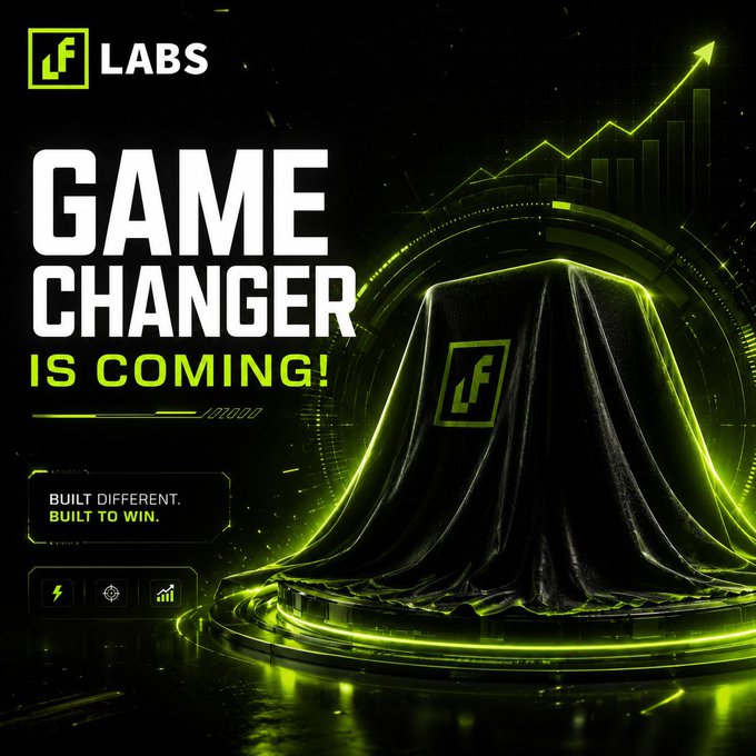 A dark promotional poster for 'LF Labs' featuring a covered mysterious object with a 'GAME CHANGER IS COMING!' headline and the tagline 'BUILT DIFFERENT. BUILT TO WIN.'