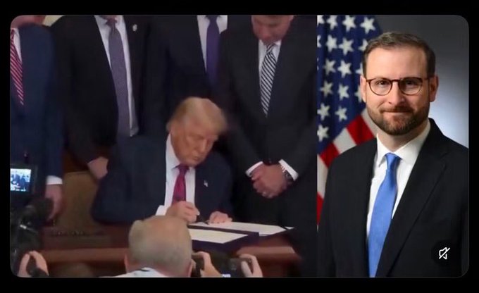 A split image showing Donald Trump signing a document at a podium on the left, and a man with glasses and a beard in a dark suit with a blue tie in front of an American flag on the right.
