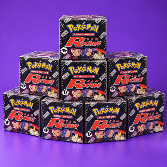 Ten sealed Pokémon Trading Card Game “Team Rocket” booster boxes are stacked against a purple background, with prominent “1st Edition” branding visible on the packaging. The post links the image to its claim that 10 markets generating $500k in daily volume each could earn $330,000 per year.