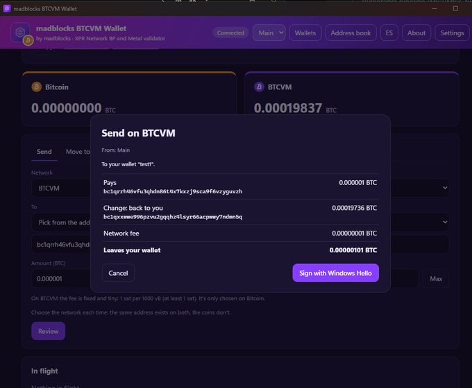 A screenshot of the madblocks BTCVM Wallet interface showing a 'Send on BTCVM' confirmation modal for a transaction of 0.000001 BTC to wallet 'test1', with options to cancel or sign with Windows Hello.