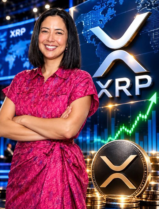 A smiling woman in a pink and red patterned outfit stands with arms crossed in front of a backdrop featuring the XRP logo, a rising green chart, and stacks of XRP coins.