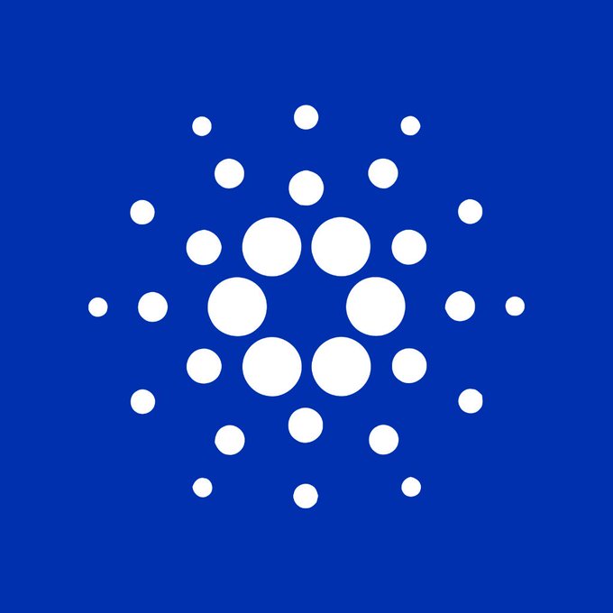 The Cardano (ADA) logo featuring a pattern of white dots on a blue background.