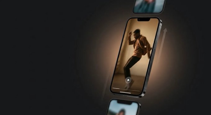A smartphone displayed against a dark background, showing a video of a person dancing on the screen with an upward arrow beside it.