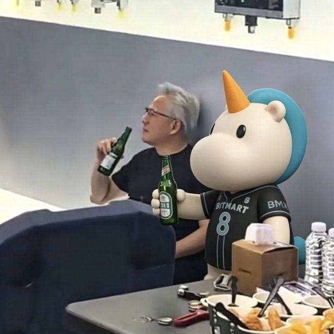 The image features a man sitting at a table with beer bottles, including a green bottle of beer that says "TradFi Crypto One" on it. The man appears to be enjoying his drink while watching TV or engaging in another activity. In the background, there is a cartoon character wearing a blue hat and holding an orange horn, which adds a playful element to the scene. The post also mentions BitMart Futures and AI, suggesting that the image might be related to cryptocurrency trading or artificial intelligence applications.