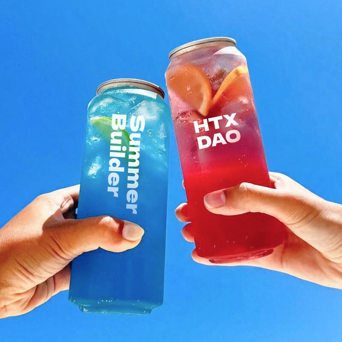 Two hands clinking beverage cans against a bright blue sky in a celebratory toast; the left can is blue with lime and reads 'Summer Builder', while the right is red with orange slices and reads 'HTX DAO'.