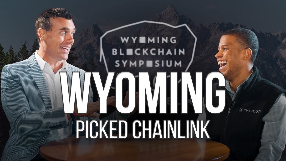 A thumbnail showing two men laughing at a table with a 'WYOMING BLOCKCHAIN SYMPOSIUM' logo and mountains in the background, with the text 'WYOMING PICKED CHAINLINK'.