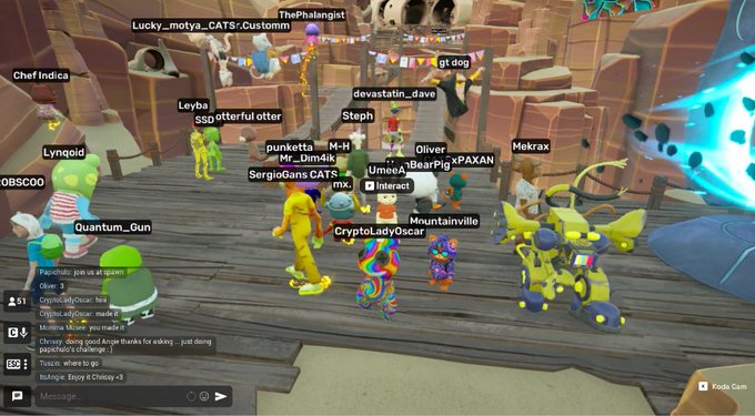 A screenshot from a virtual reality game showing various colorful avatar characters with usernames like 'Cryp.toLadyOscar', 'Oliver', 'BearPig', and 'MOUNTAINVILLE' gathered in a canyon-like environment.