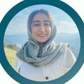 A circular profile picture shows a smiling woman wearing a gray hijab and scarf against a coastal landscape, likely representing the artist or host of the AEW NFT collection announcement.