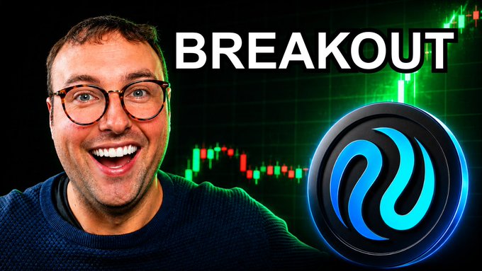 The image features a man wearing glasses, smiling for the camera with his arms outstretched. The background of the image shows a graph or chart related to cryptocurrency trading, possibly indicating a rise in Bitcoin prices. The caption "BREAKOUT" is written above the man's head and below the chart, suggesting that there might be an upcoming event or change in the market.