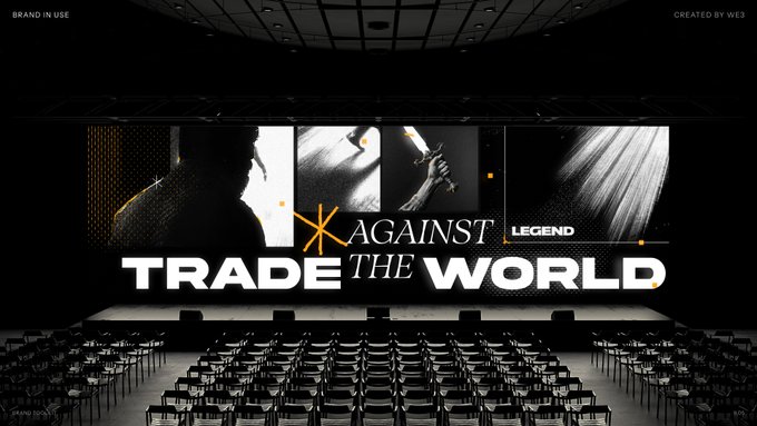A dark concert/conference venue with a large stage screen displaying 'AGAINST LEGEND TRADE THE WORLD' with concert seating arranged in rows.