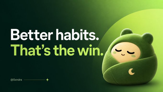 A motivational graphic featuring a cute green bear-like plush character wrapped in a blanket with a moon symbol, alongside the text 'Better habits. That's the win.' credited to @Oxndra.