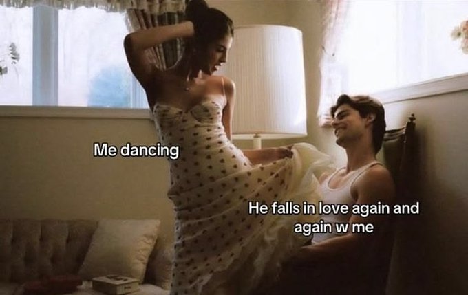 A meme image showing a couple in a bedroom; a woman in a polka dot dress is labeled 'Me dancing' while a man gazing at her is labeled 'He falls in love again and again w me'.