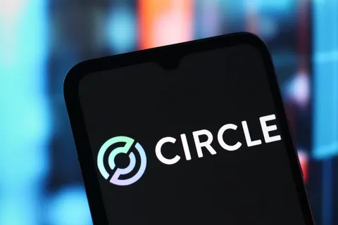 A smartphone displaying the Circle app logo (a stylized circular icon) with the text "CIRCLE" illuminated on the screen against a blurred background.