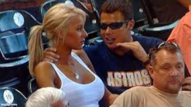 A blonde woman in a white tank top sits next to a man wearing an "ASTROS" shirt at what appears to be a baseball game, while another man in the foreground looks on. The meme caption humorously captures the betrayal felt by crypto traders when FlowHorse promised to hold the FROHORSE token but sold anyway, similar to the side-eye reaction in the image.