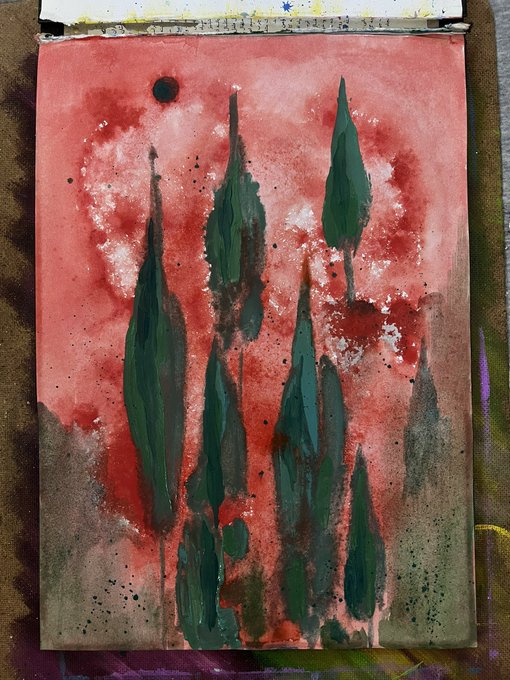 A photograph of a watercolor or mixed-media painting featuring dark green cypress tree silhouettes against a vibrant red sky with a dark circular moon or sun.