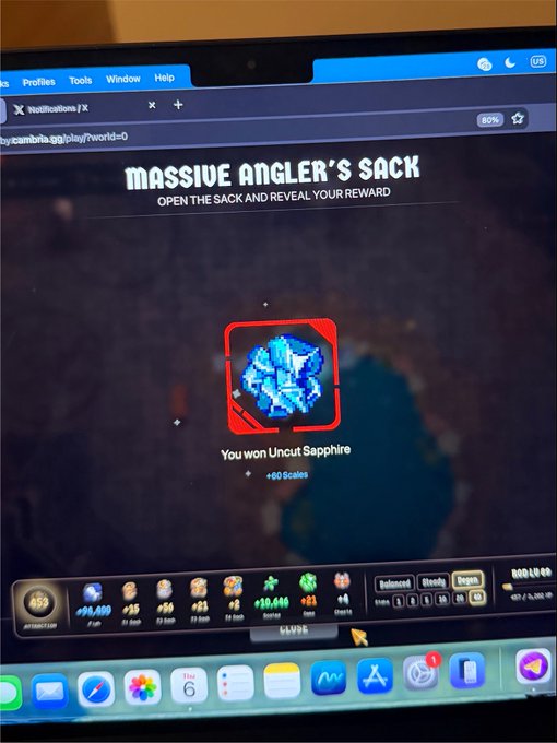 A computer screen displays a ZTGame/Telegram mini-game showing a "MASSIVE ANGLER'S SACK" reward screen with the message "You won Uncut Sapphire +60 Scales."