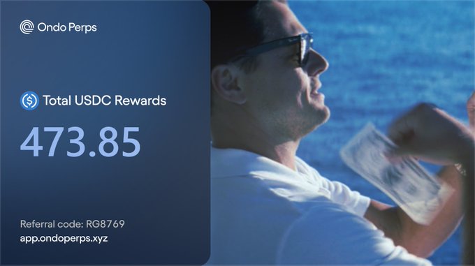 A promotional graphic for 'Ondo Perps' showing 'Total USDC Rewards 473.85' alongside a cinematic image of a man in sunglasses holding cash against a blue ocean backdrop, with referral code RG8769 and app link.
