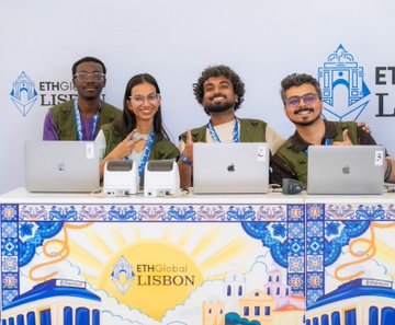 Four people smiling behind a booth at ETHGlobal Lisbon with laptops, in front of a Lisbon-themed tiled backdrop.