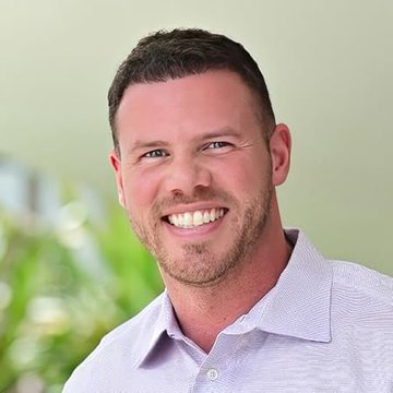 The image features a man wearing a purple shirt, smiling at the camera with his eyes closed. The caption below the photo reads "JUST IN: Jake Claver Says 'I'm more bullish on $XRP than I've ever been.'". This suggests that there is an ongoing conversation or discussion about cryptocurrency, specifically Bitcoin, and its value in relation to other assets like the US dollar.

The man's smile indicates a positive sentiment towards the topic of cryptocurrency, while his eyes closed might suggest that he is deep in thought or contemplation. The caption provides context for the image by referencing a recent statement made by someone named Jake Claver about Bitcoin and its value compared to the US dollar.