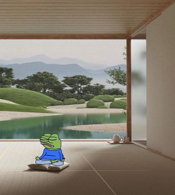 A cartoon frog character in a blue shirt meditating peacefully on a cushion in a traditional Japanese room overlooking a serene zen garden with a pond.