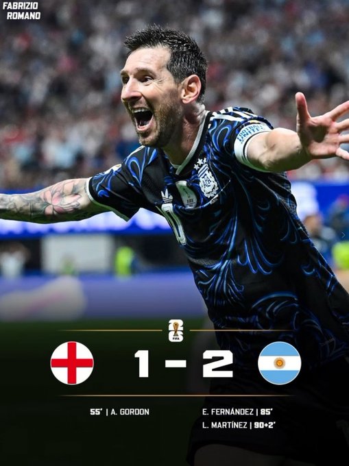 Lionel Messi celebrates wildly in Argentina's blue away kit after their 2-1 comeback win over England, with goals from E. Fernández (85') and L. Martínez (90'+2') overturning A. Gordon's 55th-minute opener to seal a dramatic quarterfinal victory.