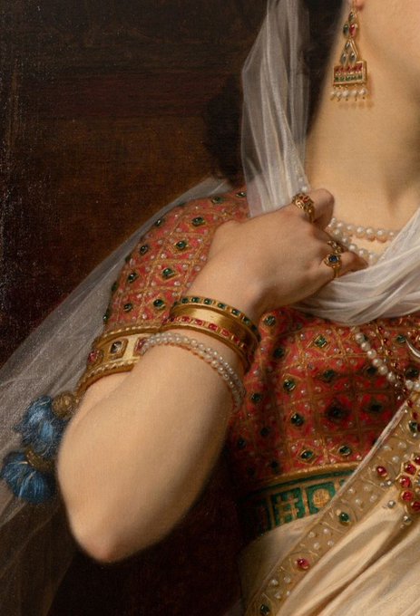 A detailed close-up of a classical painting showing a woman's hand adorned with pearls and gold bracelets, draped in sheer white fabric and a jeweled red garment.