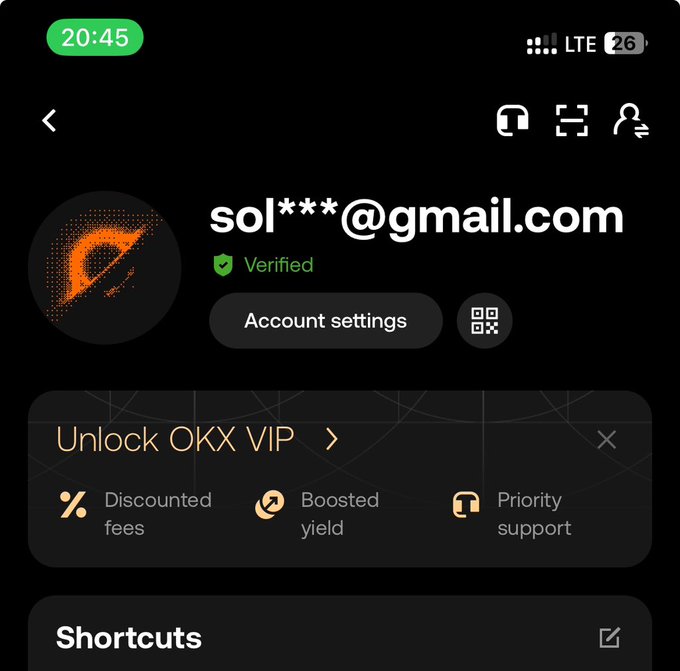 An OKX cryptocurrency app screen showing a verified email account (sol***@gmail.com) with a prompt to 'Unlock OKX VIP' for discounted fees, boosted yield, and priority support.
