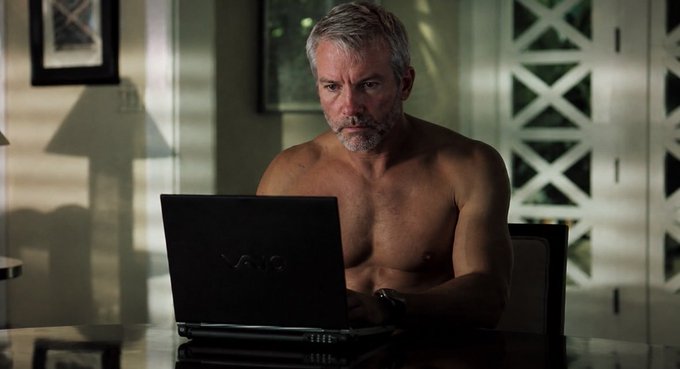 A shirtless older man with gray hair and a beard sits intently at a table working on a Sony VAIO laptop, his furrowed expression suggesting deep concentration. The image humorously illustrates the post's request—capturing the exasperated, somewhat absurd determination of someone urgently seeking ways to make Bitcoin's price rise.
