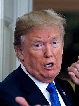 Former President Donald Trump is pictured reacting to news that the CLARITY Act, a proposal by Senate Republicans, could force him and other covered officials to sell their cryptocurrency or place them in a blind trust. The bill also includes provisions for crypto probes and stablecoin freeze powers.