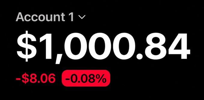 A mobile account dashboard displays "Account 1" with a balance of $1,000.84, showing a daily loss of -$8.06 or -0.08% highlighted in red.