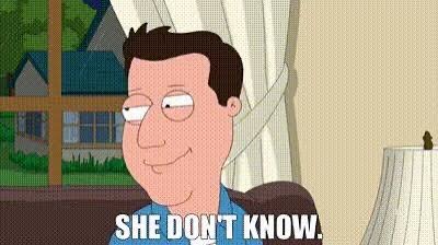 A GIF of an animated man with brown hair smiling slyly, with the caption 'SHE DON'T KNOW.' displayed at the bottom of the frame.