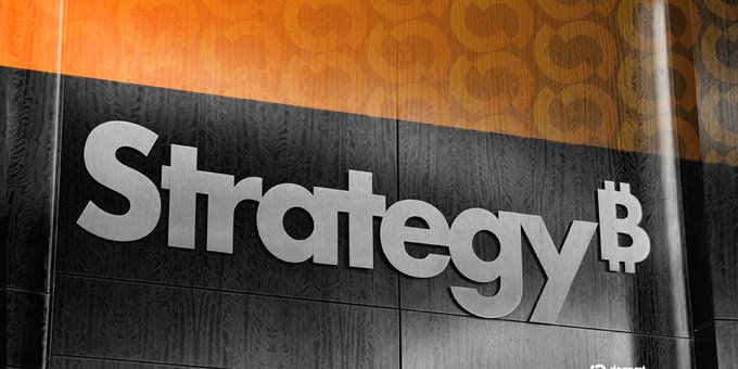 A wall sign reads 'Strategy₿' with a Bitcoin symbol replacing the letter B, set against an orange and dark gray background.